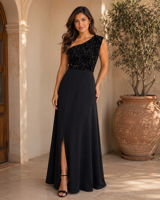 S0006 VESTIDO NEGRO LARGO, ASIMÉTRICO CON UN SÓLO HOMBRO, LENTEJAS EN EL PETO, ABIERTA EN LA FALDA